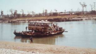 This photo, taken in early 1982, is of JTE being rowed across the river at Narianghat, Nepal (advised by Brian Hedley)